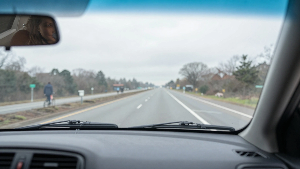 View from inside a car showing clear road and overcast sky for testing